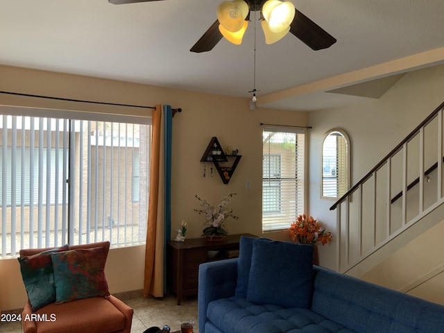 living room with ceiling fan and a wealth of natural light