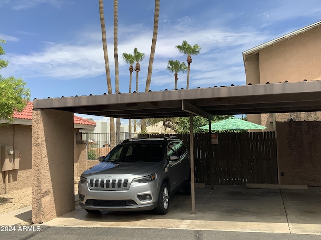 view of parking / parking lot with a carport