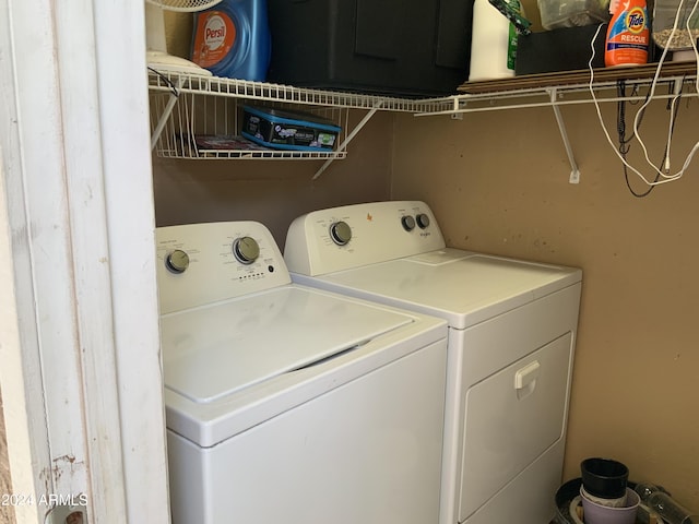 laundry room featuring washing machine and dryer