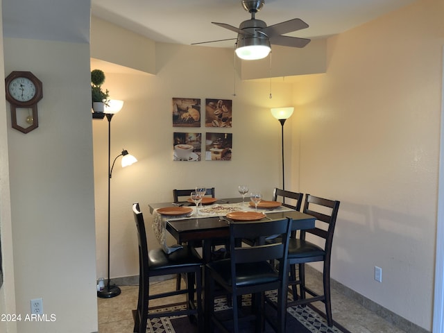 dining space featuring ceiling fan