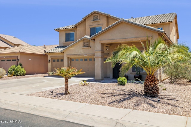 46141 W Rainbow Dr, Maricopa, AZ 85139 - view of front of property featuring stucco siding, driveway, a tiled roof, and a garage