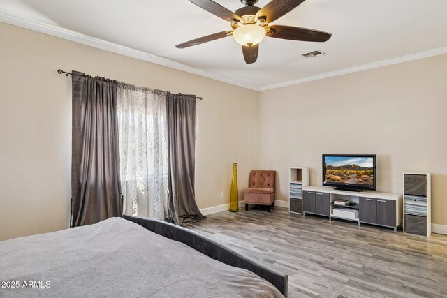 46141 W Rainbow Dr, Maricopa, AZ 85139 - bedroom with light wood-style flooring, crown molding, and ceiling fan