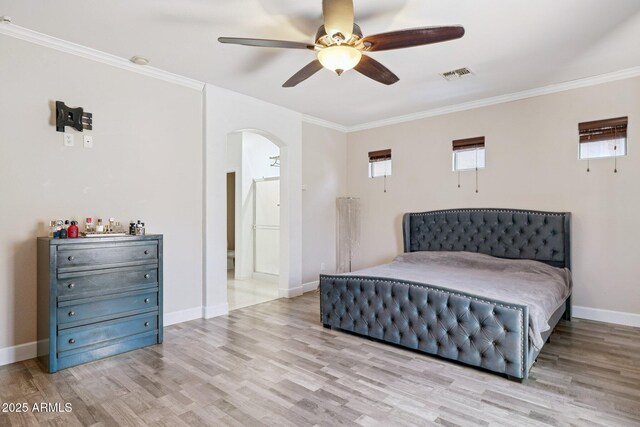 46141 W Rainbow Dr, Maricopa, AZ 85139 - bedroom featuring arched walkways, wood finished floors, crown molding, and a ceiling fan
