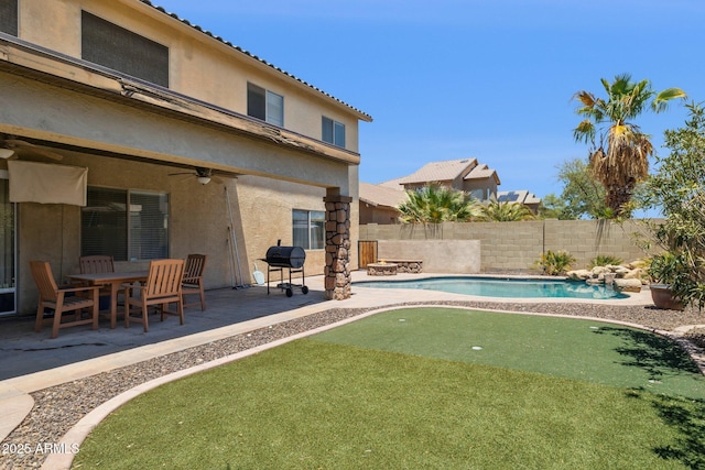 46141 W Rainbow Dr, Maricopa, AZ 85139 - view of swimming pool with a putting area, a ceiling fan, a patio, and a fenced backyard