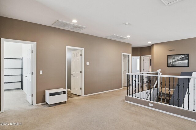 46141 W Rainbow Dr, Maricopa, AZ 85139 - corridor featuring light colored carpet, an upstairs landing, recessed lighting, and heating unit