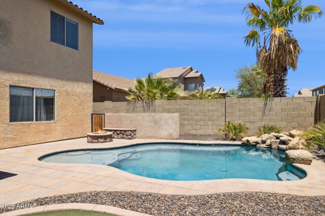46141 W Rainbow Dr, Maricopa, AZ 85139 - view of pool featuring a fire pit and a patio area