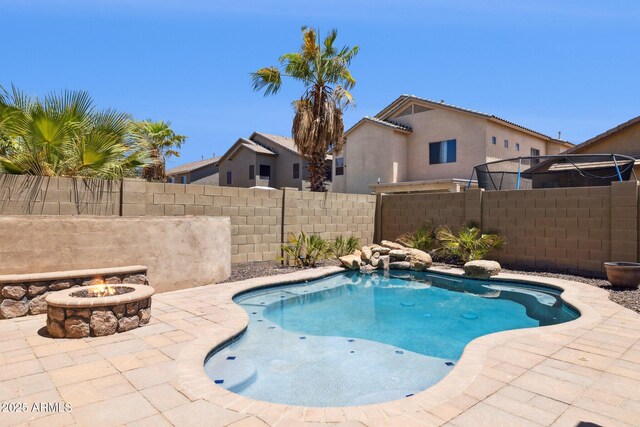 46141 W Rainbow Dr, Maricopa, AZ 85139 - view of swimming pool featuring an outdoor fire pit and a patio area