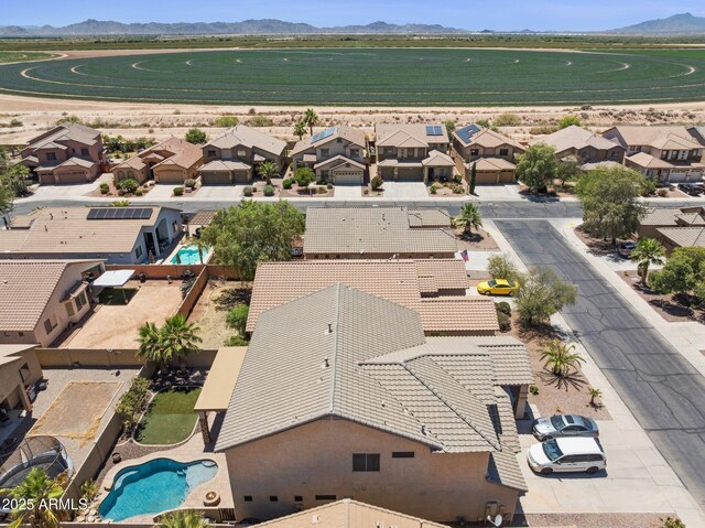 46141 W Rainbow Dr, Maricopa, AZ 85139 - aerial view of residential area featuring a pool area and a mountain backdrop