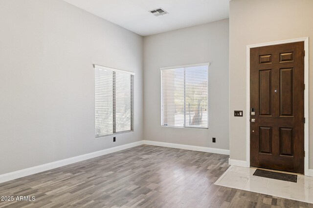 46141 W Rainbow Dr, Maricopa, AZ 85139 - foyer with wood finished floors and baseboards