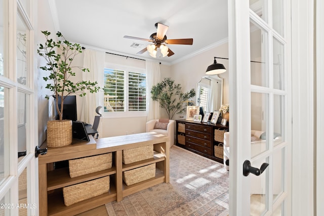interior space featuring crown molding, ceiling fan, french doors, and a wealth of natural light
