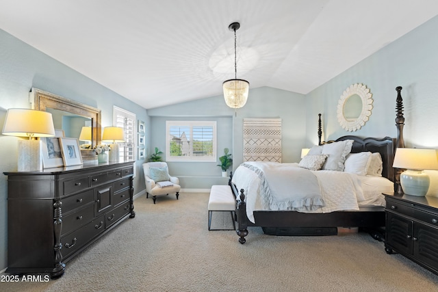 carpeted bedroom featuring baseboards and lofted ceiling