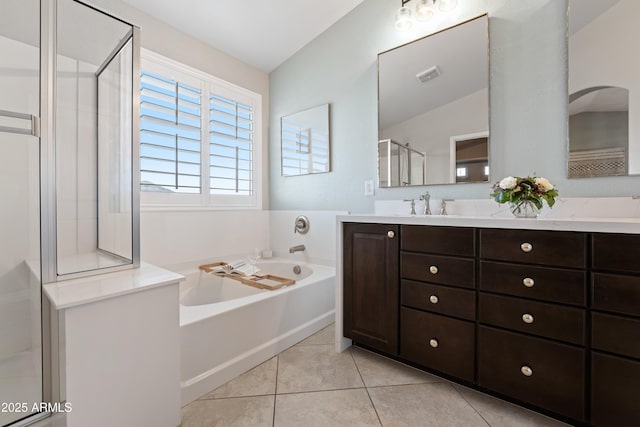 full bath featuring tile patterned flooring, vanity, visible vents, a bath, and a stall shower