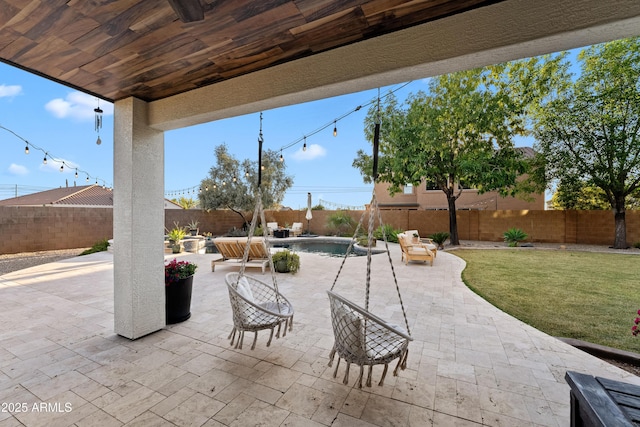 view of patio featuring a fenced in pool and a fenced backyard