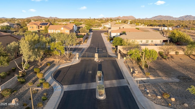 birds eye view of property with a residential view and a mountain view