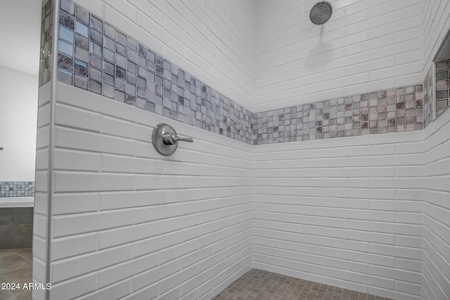 bathroom with tiled shower