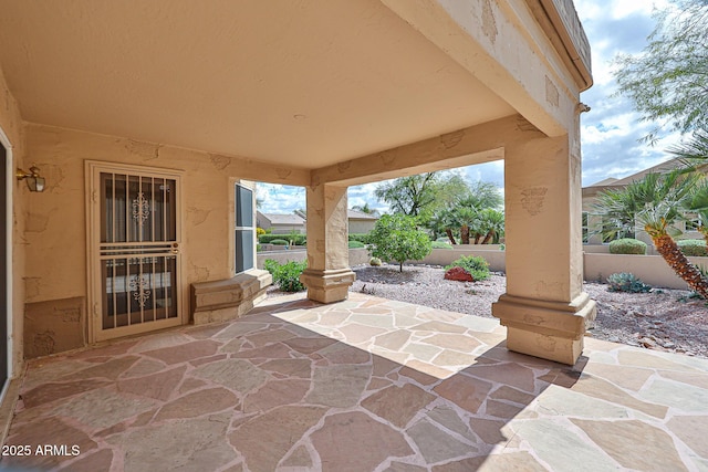 view of patio featuring fence