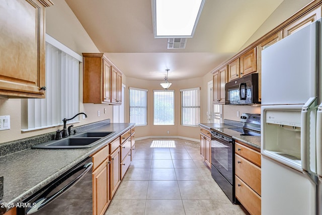 kitchen with visible vents, baseboards, light tile patterned floors, black appliances, and a sink