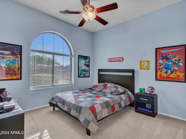 bedroom featuring ceiling fan and light carpet