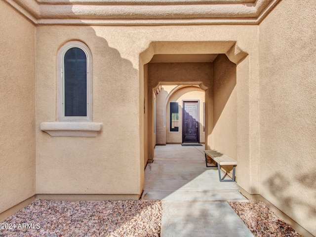 entrance to property with stucco siding