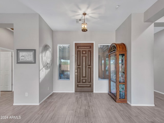 foyer entrance with light hardwood / wood-style flooring