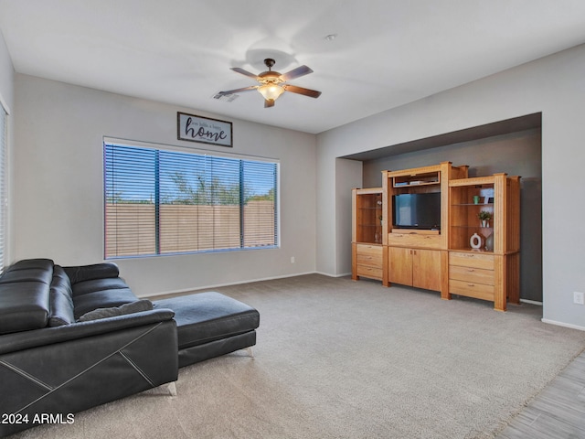 living room featuring ceiling fan and carpet floors