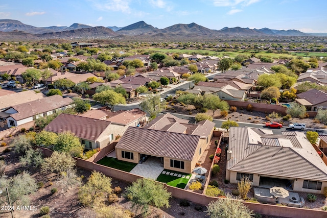 birds eye view of property with a mountain view