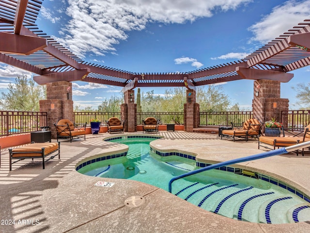 view of pool with a patio area, a pergola, and an in ground hot tub