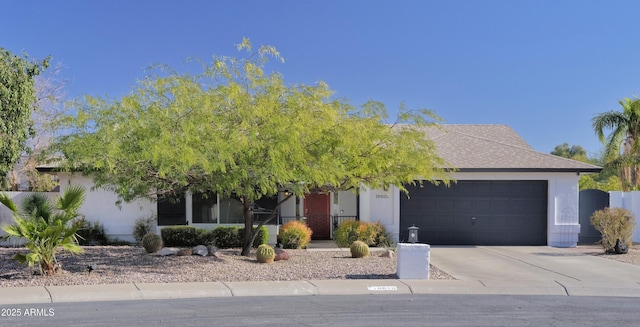 obstructed view of property featuring a garage