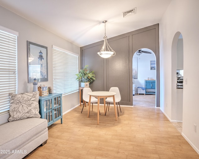 dining area featuring light wood-type flooring