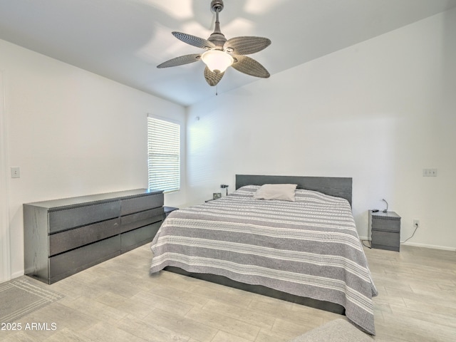 bedroom featuring ceiling fan and light hardwood / wood-style flooring