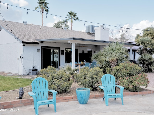 back of property with a patio and central air condition unit