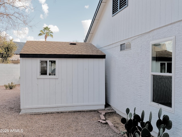 view of property exterior with a shed