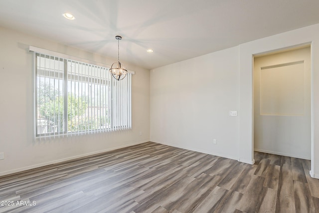 27413 W Tonopah Dr, Buckeye, AZ 85396 - empty room with wood finished floors, a chandelier, recessed lighting, and baseboards