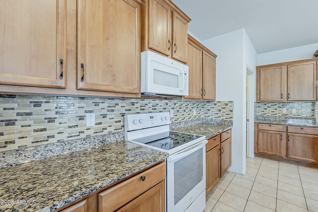 27413 W Tonopah Dr, Buckeye, AZ 85396 - kitchen with white appliances, decorative backsplash, light stone countertops, and light tile patterned flooring