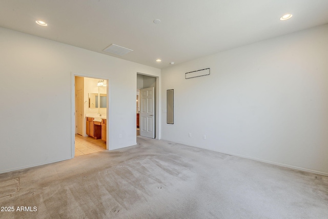 27413 W Tonopah Dr, Buckeye, AZ 85396 - unfurnished bedroom with light carpet, recessed lighting, and connected bathroom