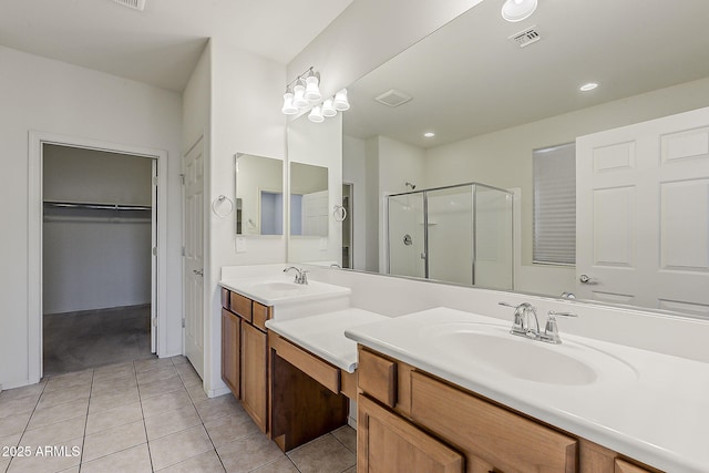 27413 W Tonopah Dr, Buckeye, AZ 85396 - full bath featuring a shower stall, tile patterned floors, vanity, a spacious closet, and recessed lighting
