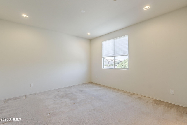 27413 W Tonopah Dr, Buckeye, AZ 85396 - empty room featuring light carpet, recessed lighting, and baseboards