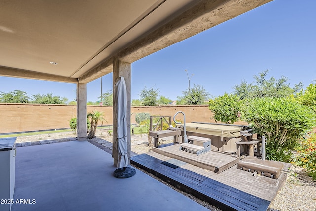 27413 W Tonopah Dr, Buckeye, AZ 85396 - view of patio / terrace featuring a hot tub and fence