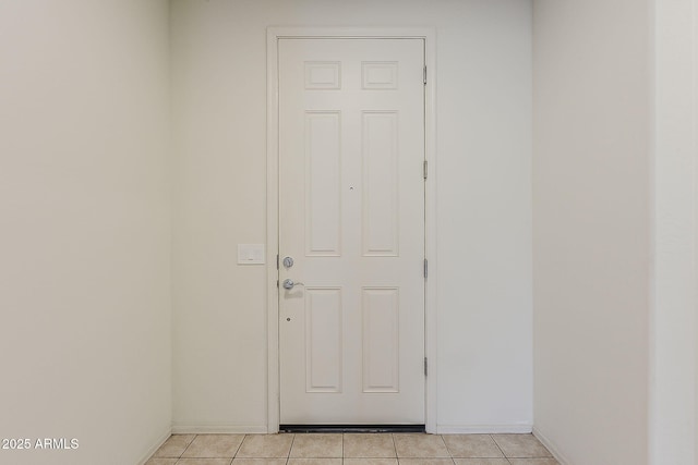 27413 W Tonopah Dr, Buckeye, AZ 85396 - doorway to outside featuring light tile patterned floors and baseboards