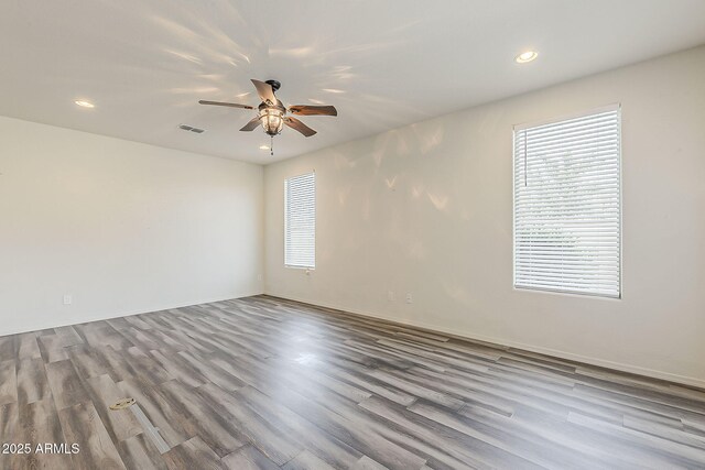 27413 W Tonopah Dr, Buckeye, AZ 85396 - spare room with a ceiling fan, recessed lighting, wood finished floors, and baseboards