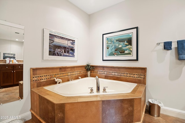 3801 N Goldwater Blvd Unit 201, Scottsdale, AZ 85251 - full bath with baseboards, vanity, a garden tub, and tile patterned floors