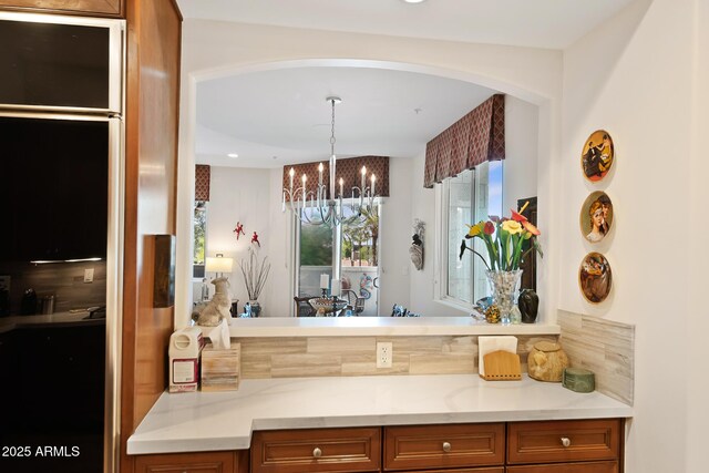 3801 N Goldwater Blvd Unit 201, Scottsdale, AZ 85251 - bathroom with a chandelier and vanity