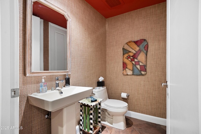 3801 N Goldwater Blvd Unit 201, Scottsdale, AZ 85251 - bathroom featuring toilet, tile patterned floors, and baseboards