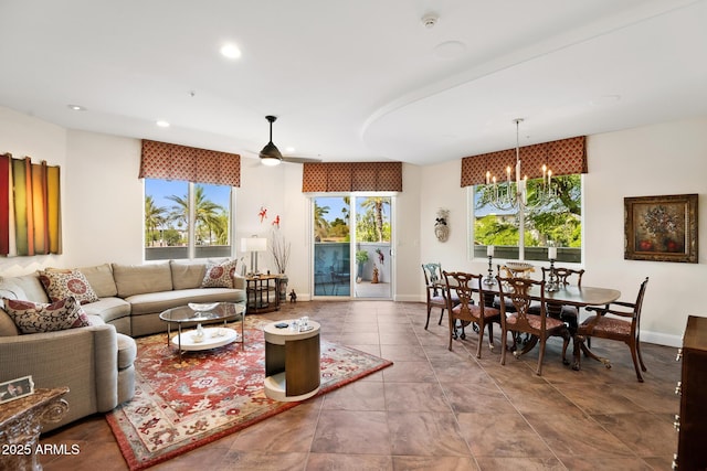 3801 N Goldwater Blvd Unit 201, Scottsdale, AZ 85251 - living area featuring healthy amount of natural light, a chandelier, recessed lighting, baseboards, and ceiling fan