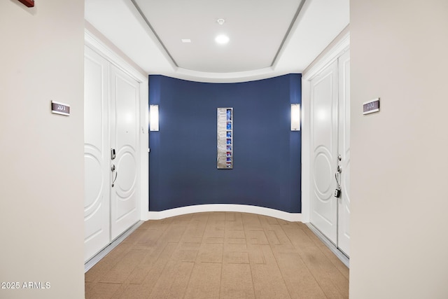 3801 N Goldwater Blvd Unit 201, Scottsdale, AZ 85251 - corridor with a raised ceiling, baseboards, and tile patterned floors