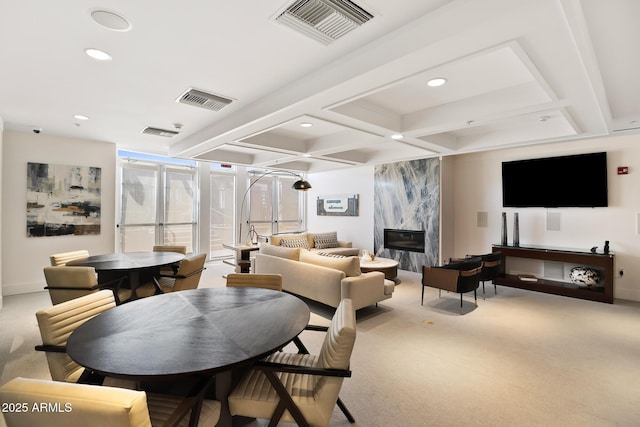 3801 N Goldwater Blvd Unit 201, Scottsdale, AZ 85251 - dining space with carpet flooring, recessed lighting, beamed ceiling, coffered ceiling, and a fireplace