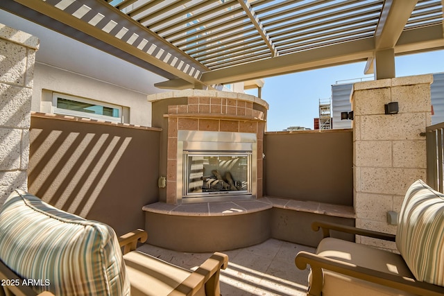 3801 N Goldwater Blvd Unit 201, Scottsdale, AZ 85251 - view of patio featuring a tile fireplace