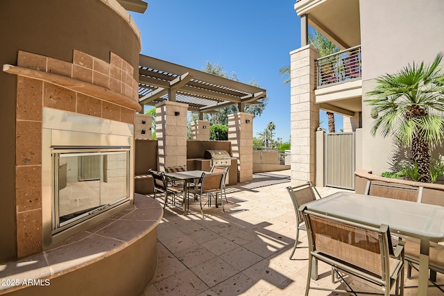 3801 N Goldwater Blvd Unit 201, Scottsdale, AZ 85251 - view of patio featuring outdoor dining area, a pergola, and a balcony