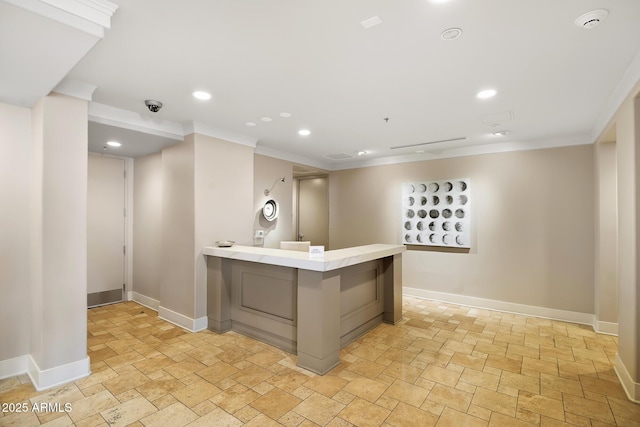 3801 N Goldwater Blvd Unit 201, Scottsdale, AZ 85251 - bar area with ornamental molding, stone tile floors, baseboards, and recessed lighting