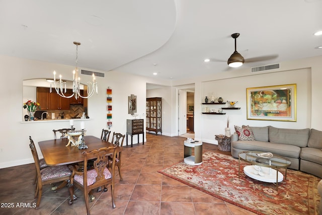 3801 N Goldwater Blvd Unit 201, Scottsdale, AZ 85251 - dining area with a chandelier, ceiling fan, recessed lighting, and baseboards